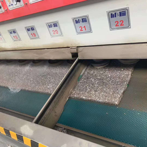 Automatic polishing machine for marble or graniteslabs
